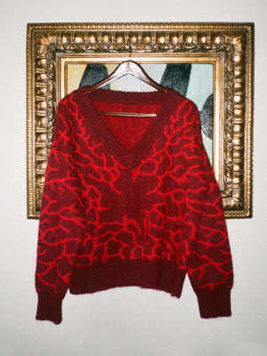 Knitted jumper in maroon with red mycelium pattern knitted throughout. Mohair blend.