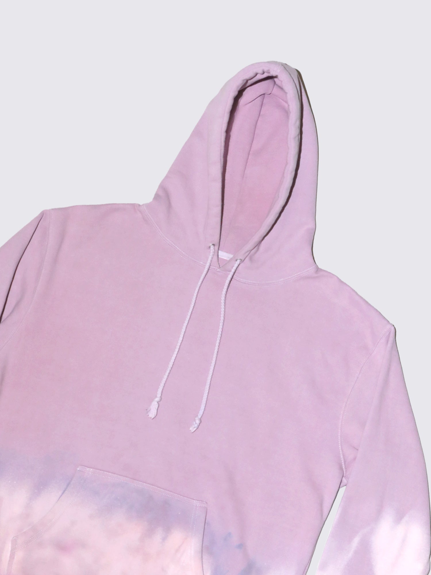 Tie dye hoody in lilac with pink and purple hues. Made from 100% cotton.