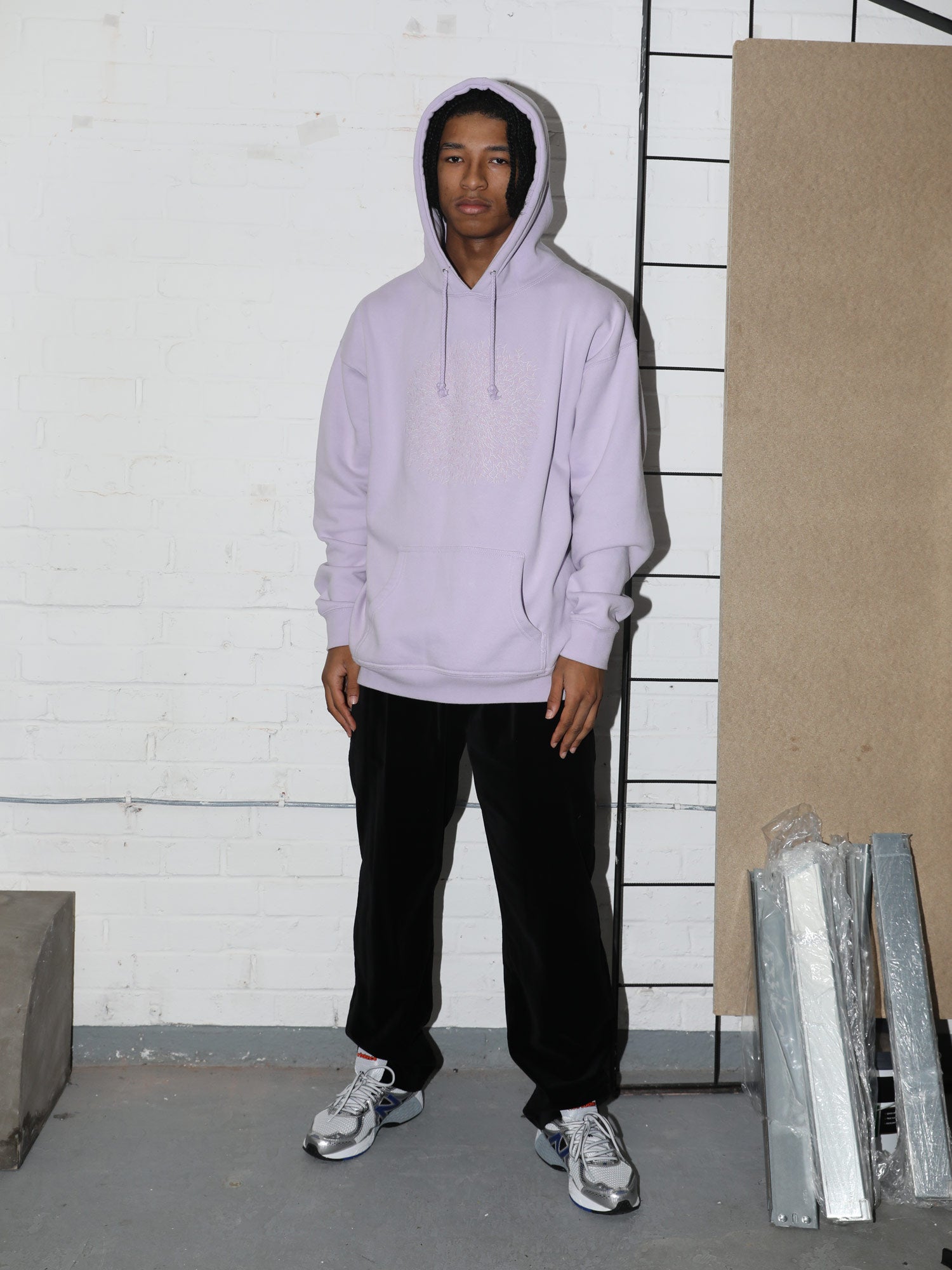 Model wears the lilac hoodie, styled with velour track pants. Comfort plus. 