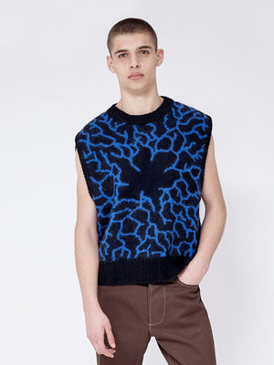 Showing the fit of knitted vest. Crew neck, low arm drop. Cropped at the hip length.