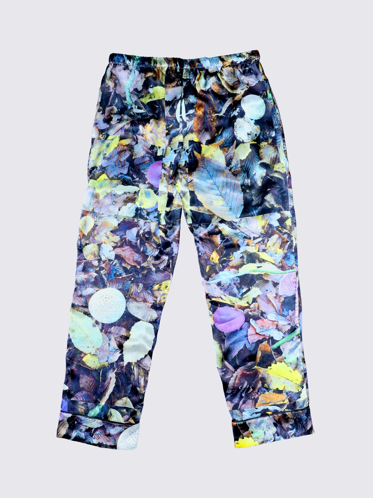 Silk pj bottoms. Photos of colourful leaves and mushrooms make up the print on the silk PJ set.